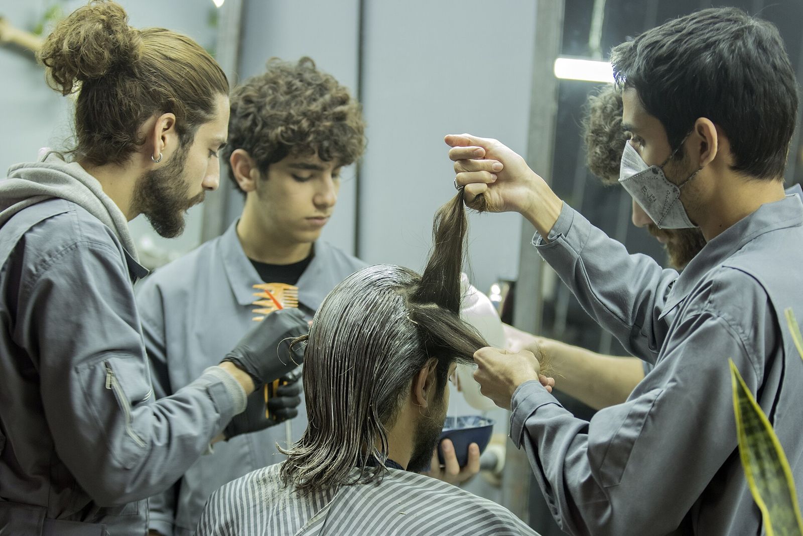 A stylist applying color